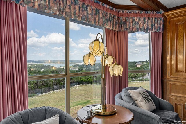 sitting room featuring a water view