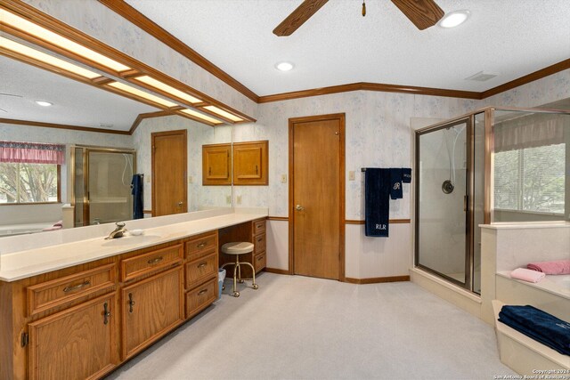 bathroom featuring a shower with shower door, a textured ceiling, crown molding, vanity, and ceiling fan