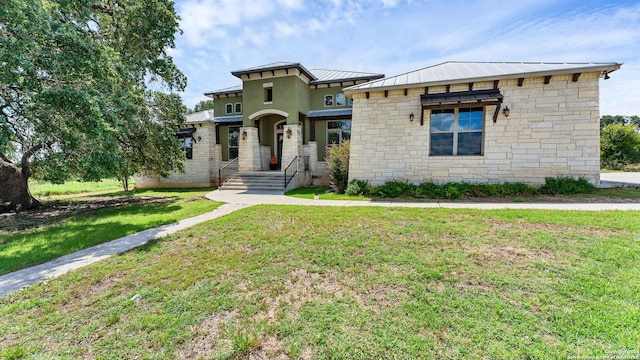 view of front of house with a front lawn