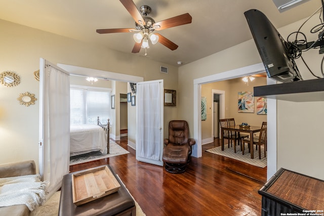 living room with hardwood / wood-style floors and ceiling fan