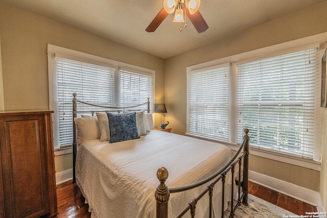 bedroom featuring ceiling fan and hardwood / wood-style floors