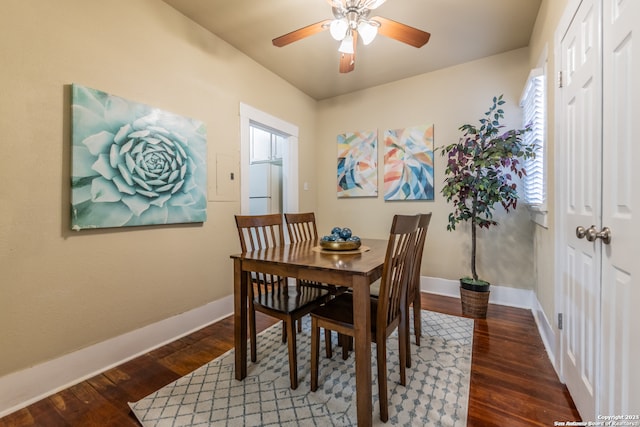 dining area featuring ceiling fan and dark hardwood / wood-style flooring