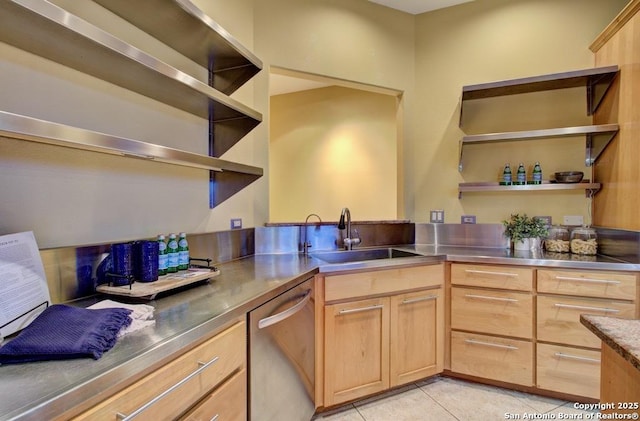 kitchen with sink, stainless steel counters, light brown cabinets, and dishwasher