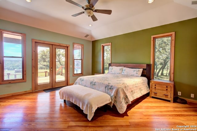 bedroom with access to exterior, french doors, ceiling fan, light hardwood / wood-style flooring, and lofted ceiling