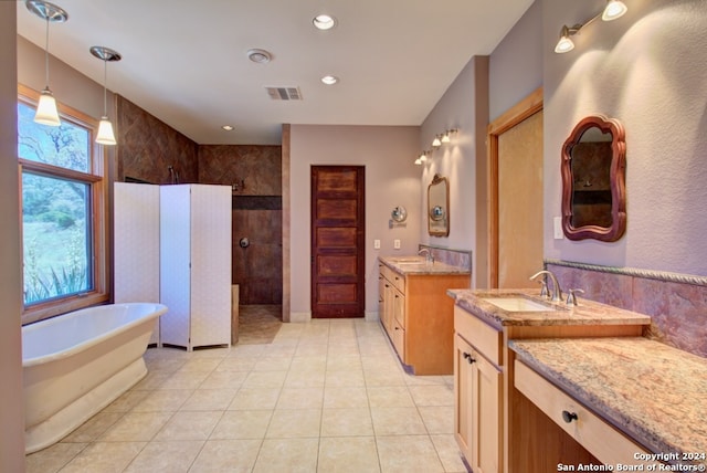 bathroom featuring tile patterned floors, vanity, and independent shower and bath