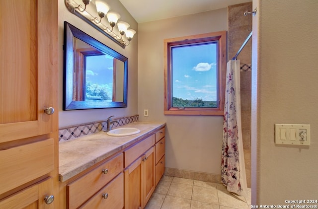 bathroom featuring a shower with curtain, a wealth of natural light, tile patterned flooring, and vanity