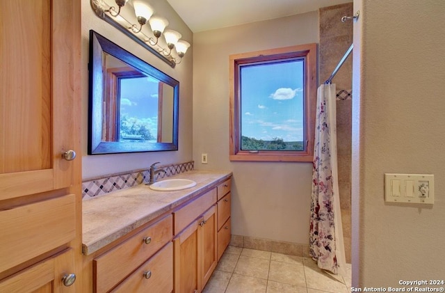 bathroom with vanity, tile patterned flooring, and curtained shower