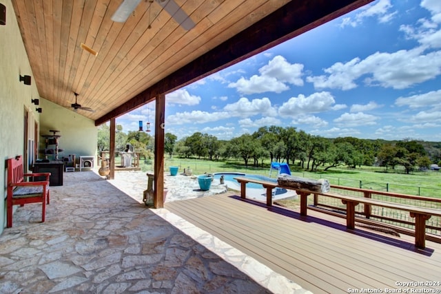 view of patio / terrace featuring a pool side deck and ceiling fan