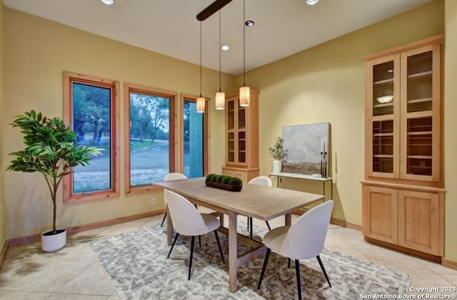 dining space featuring light tile patterned floors