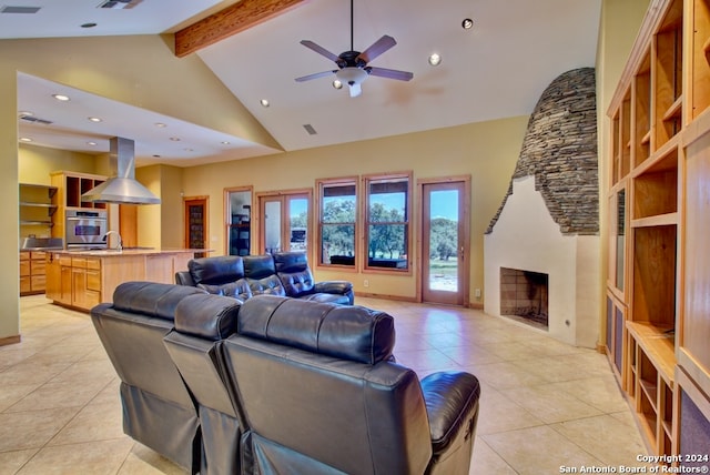 tiled living room featuring beamed ceiling, ceiling fan, sink, and high vaulted ceiling