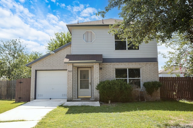 view of front property featuring a front lawn and a garage