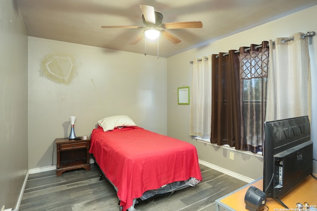 bedroom featuring ceiling fan and dark hardwood / wood-style flooring