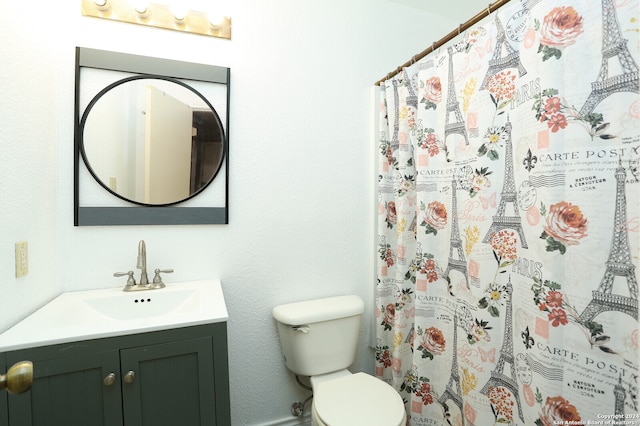 bathroom with toilet and vanity