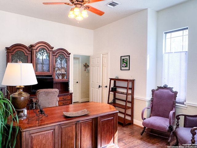 office space featuring hardwood / wood-style flooring and ceiling fan