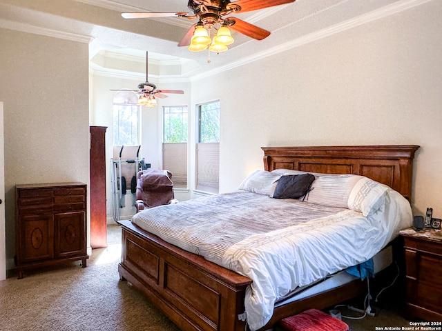 bedroom with ceiling fan, ornamental molding, carpet floors, and a tray ceiling