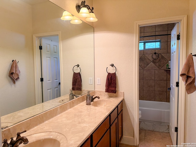 full bathroom featuring tile patterned floors, double sink vanity, toilet, and tiled shower / bath