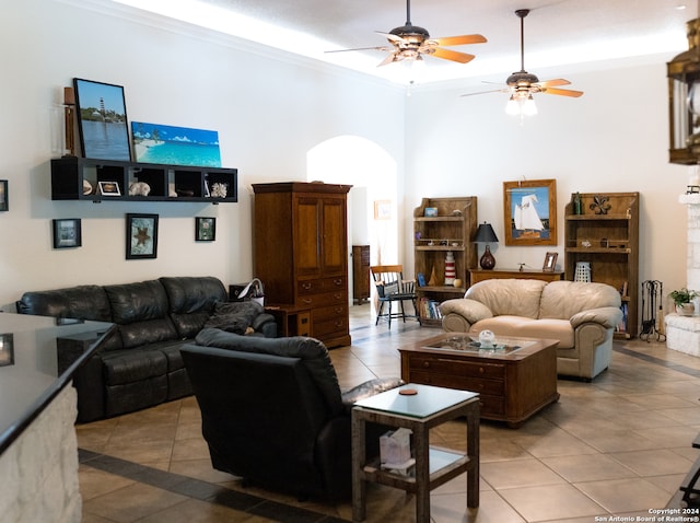 living room featuring ceiling fan and light tile patterned floors