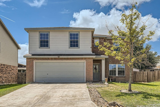 traditional-style home with an attached garage, brick siding, fence, driveway, and a front lawn