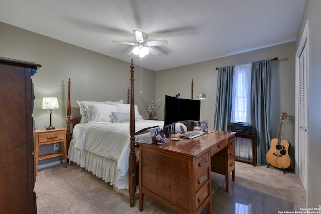 bedroom with light carpet, a closet, and ceiling fan