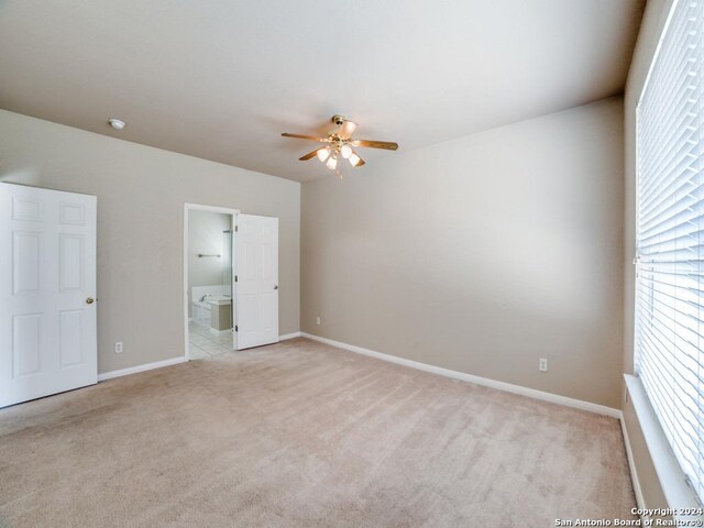 bathroom with tile patterned floors, vanity, and shower with separate bathtub