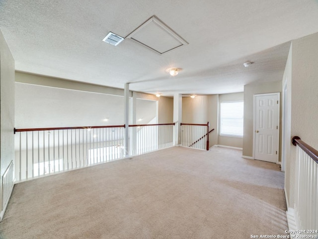 spare room with light colored carpet