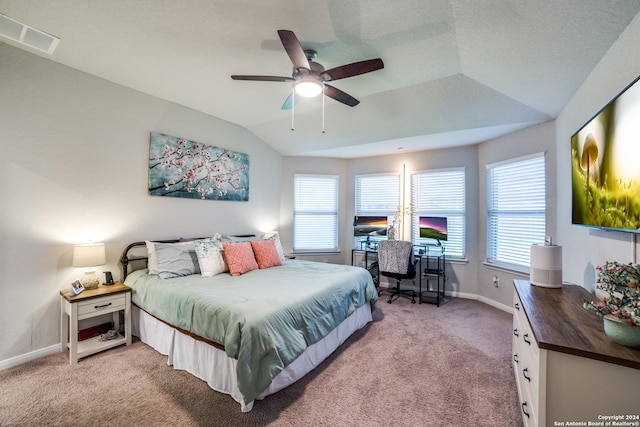 bedroom with ceiling fan, light carpet, and lofted ceiling