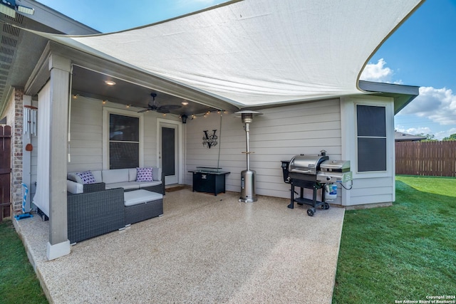 view of patio / terrace featuring ceiling fan, area for grilling, and an outdoor living space