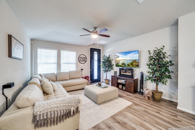 living room with ceiling fan and light hardwood / wood-style floors