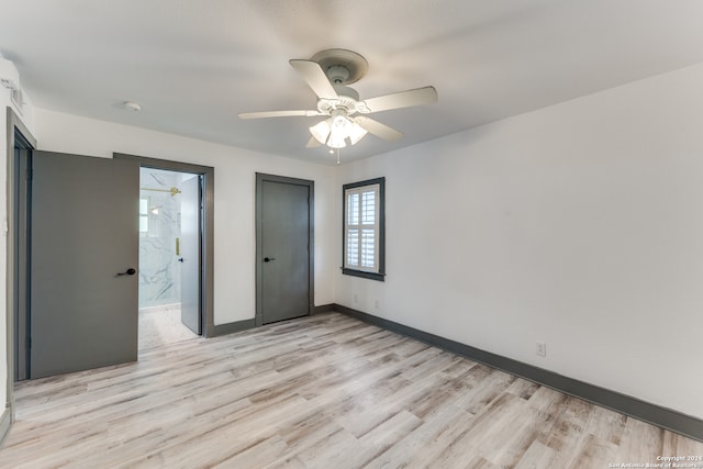 unfurnished room featuring ceiling fan and light hardwood / wood-style flooring