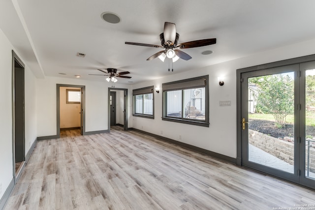 spare room featuring ceiling fan and light wood-type flooring