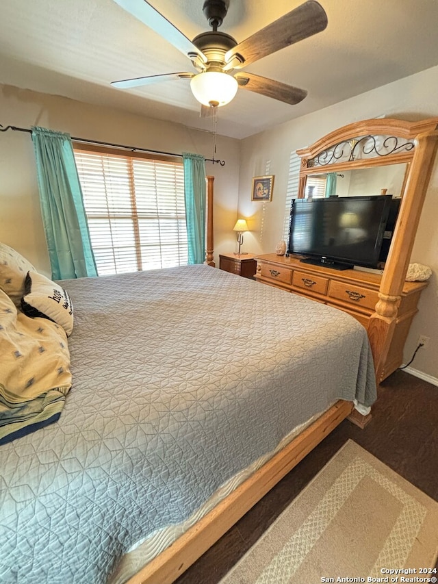 bedroom with hardwood / wood-style flooring and ceiling fan