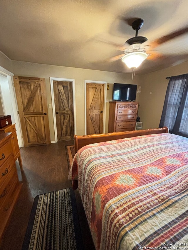 bedroom featuring wood-type flooring and ceiling fan