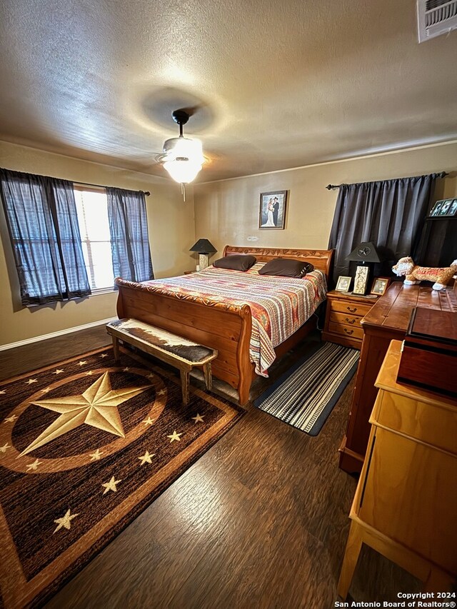 bedroom featuring hardwood / wood-style floors and ceiling fan