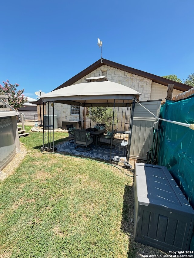 view of yard featuring a gazebo and a patio