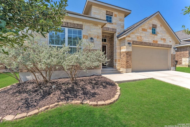 view of front of property with a front lawn and a garage