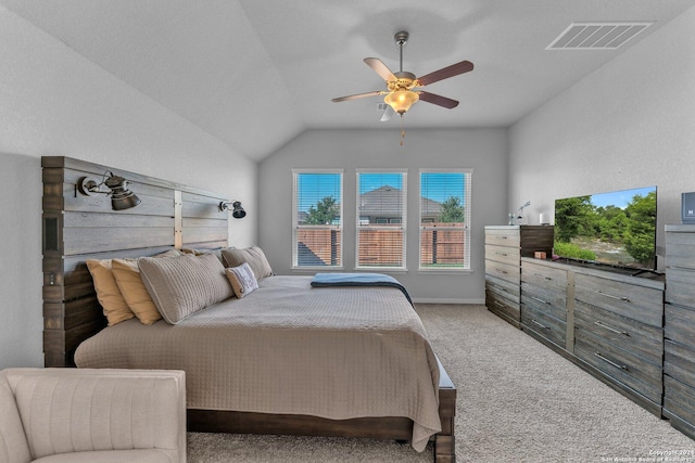 bedroom featuring ceiling fan, carpet, visible vents, and vaulted ceiling