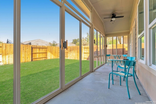 sunroom with ceiling fan and a healthy amount of sunlight