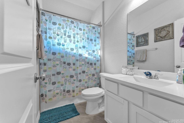 bathroom featuring toilet, tile patterned flooring, shower / bath combination with curtain, and vanity