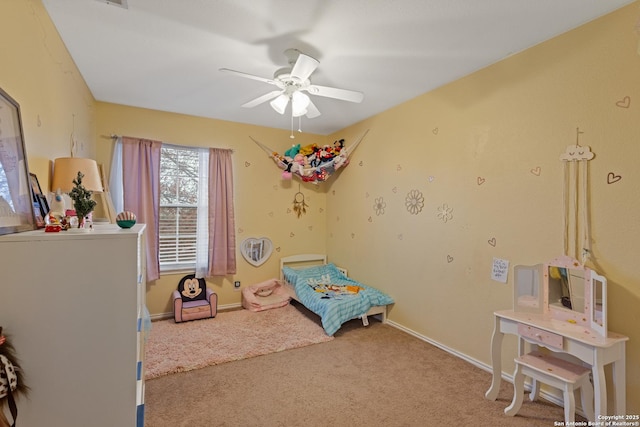 bedroom featuring light colored carpet and ceiling fan