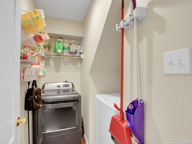 washroom with separate washer and dryer