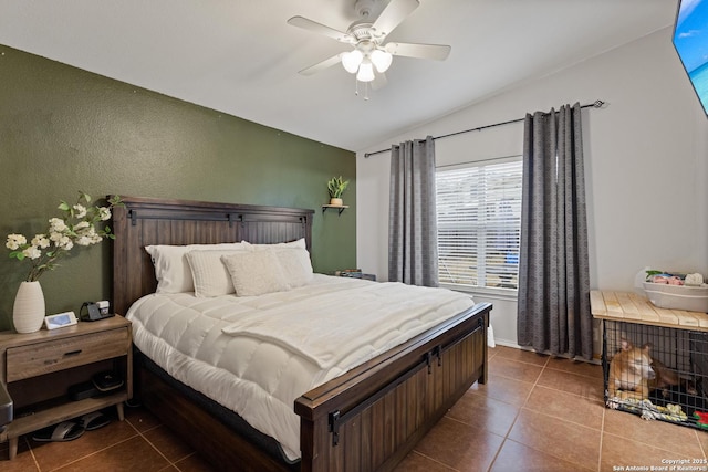 bedroom with ceiling fan, lofted ceiling, and tile patterned flooring