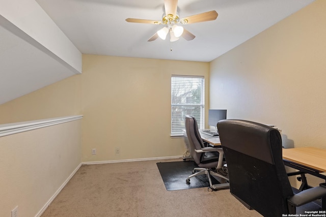 office featuring light carpet, vaulted ceiling, and ceiling fan