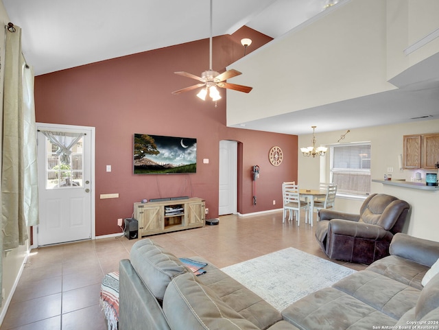 living room featuring light tile patterned flooring, high vaulted ceiling, and ceiling fan with notable chandelier