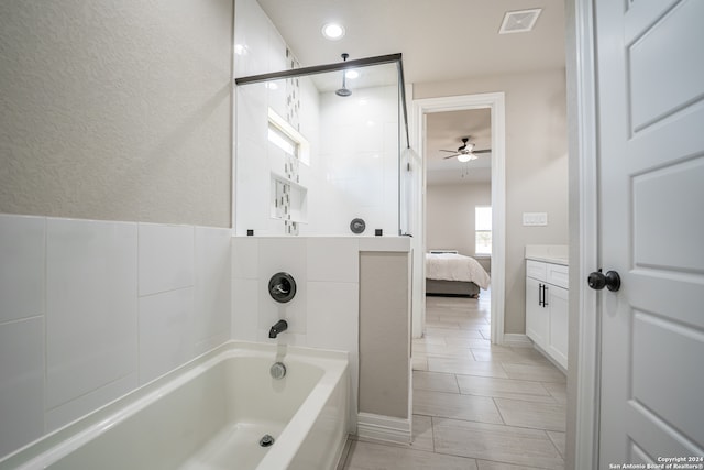 bathroom featuring ceiling fan, vanity, and tile patterned flooring