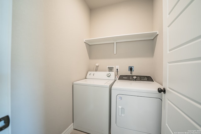 laundry room with washing machine and clothes dryer