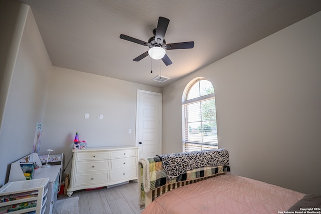 bedroom with ceiling fan and light hardwood / wood-style floors