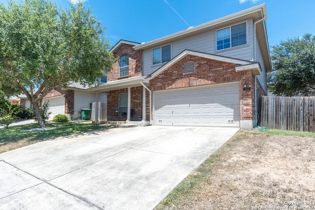 3802 Blue Oak Pass, San Antonio, TX 78223 - traditional-style home with fence, driveway, brick siding, and a garage