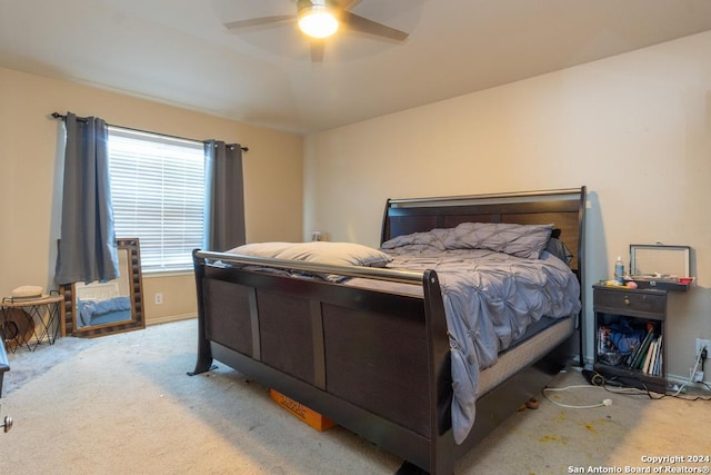 3802 Blue Oak Pass, San Antonio, TX 78223 - bedroom with baseboards, a ceiling fan, and carpet