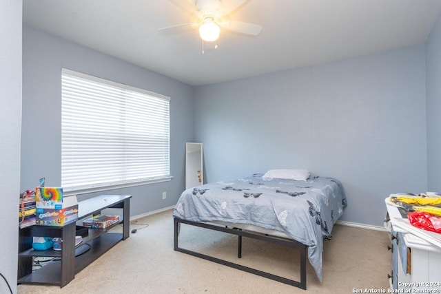 3802 Blue Oak Pass, San Antonio, TX 78223 - carpeted bedroom featuring baseboards and a ceiling fan
