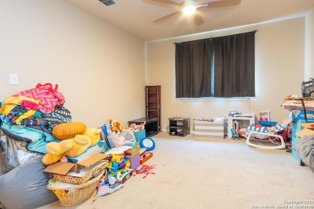 playroom with ceiling fan and carpet flooring